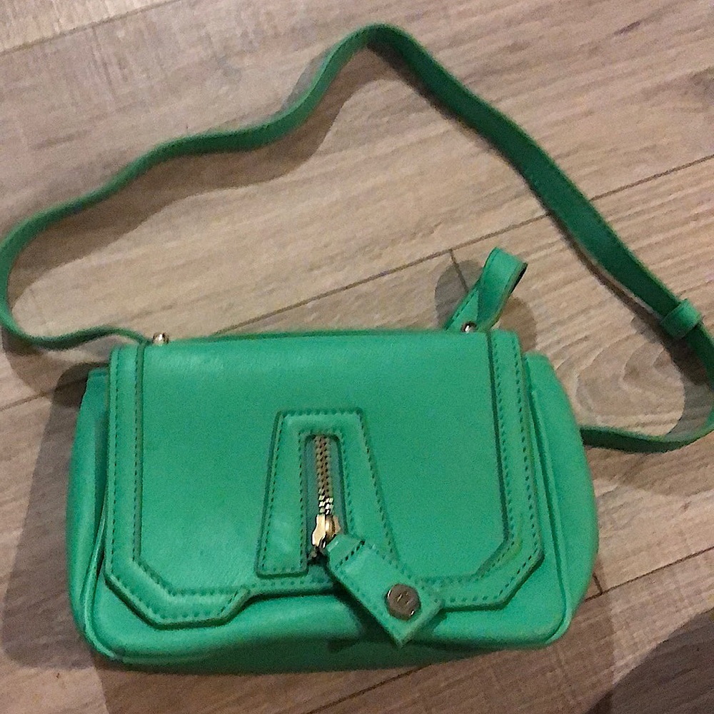 Teal purse, lightly worn. Comes with free makeup purse, never used.